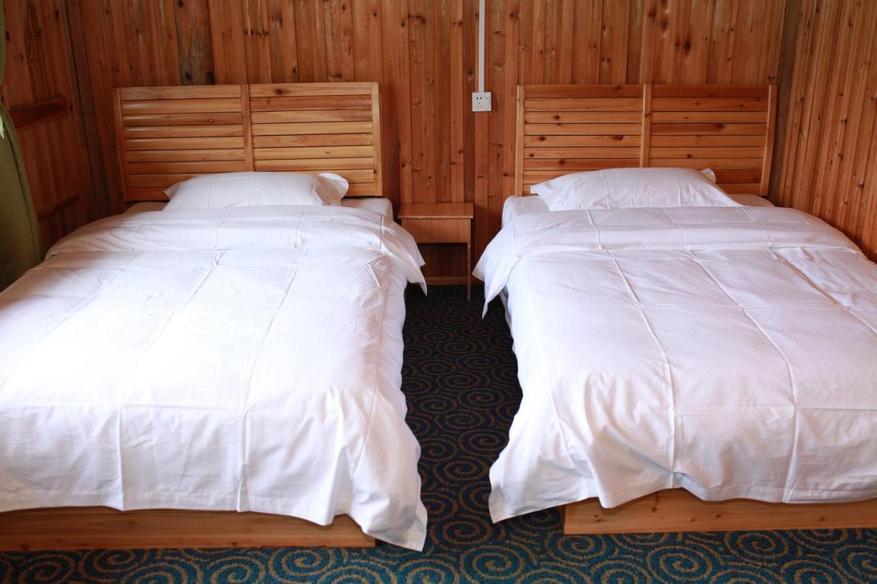 Dragon'S Den Hostel Луншэн Экстерьер фото